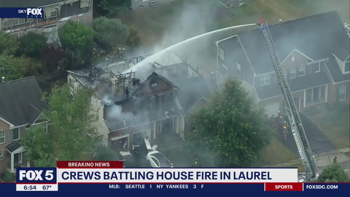 Firefighters battle 2-alarm fire in Laurel